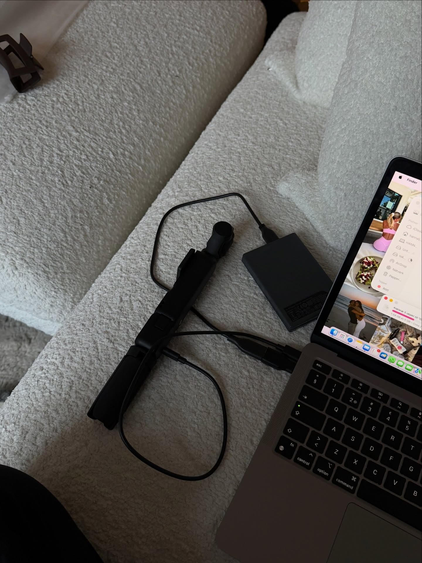 MacBook, tripod and external drive, Hanna’s editing rig